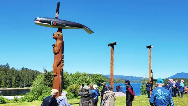 Cruise guests visit a totem park near Port Klawock.