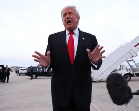 Donald Trump talking to members of the press after exiting Air Force One in Maryland